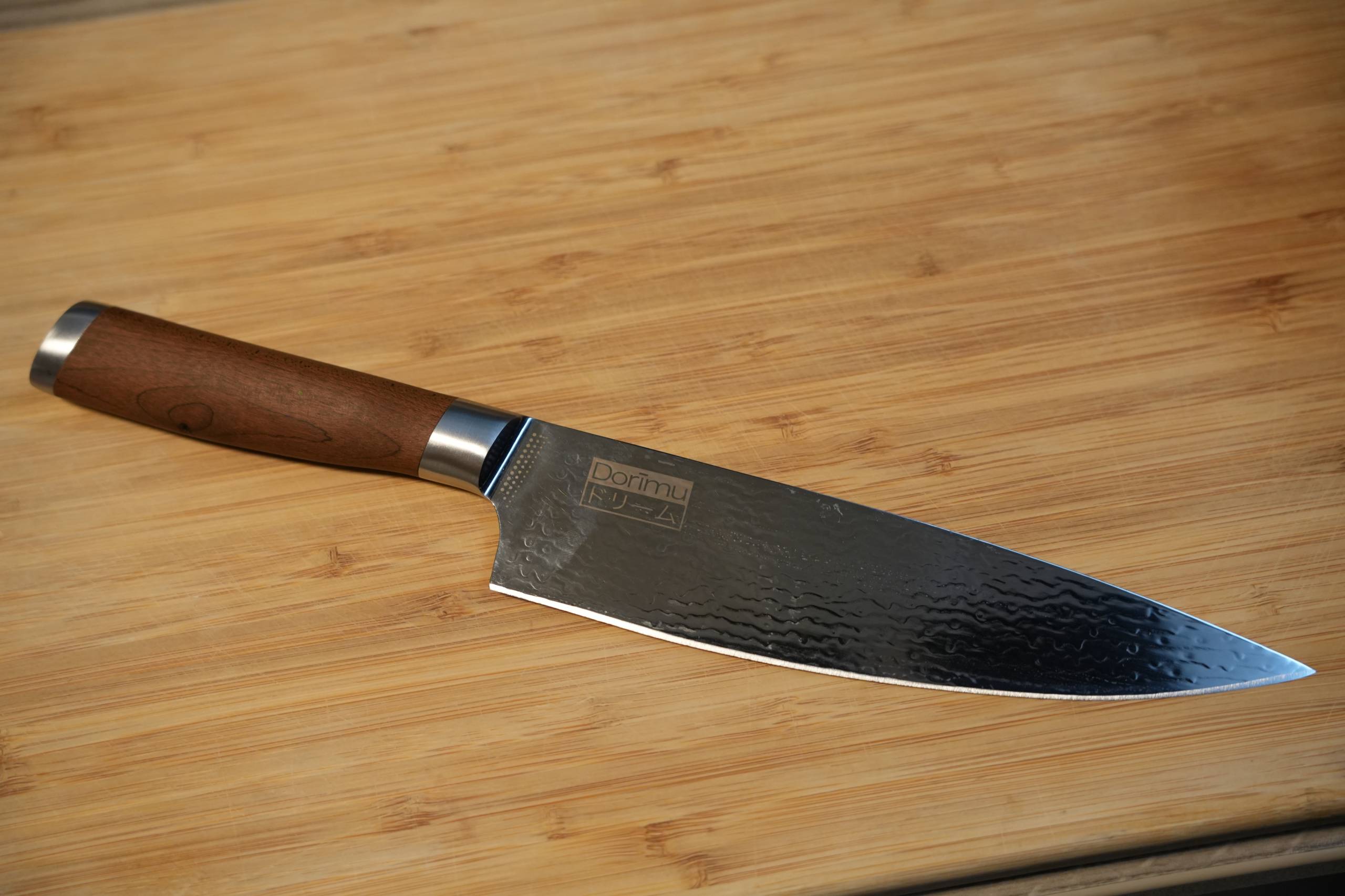 Knife with a wooden handle on a wooden surface